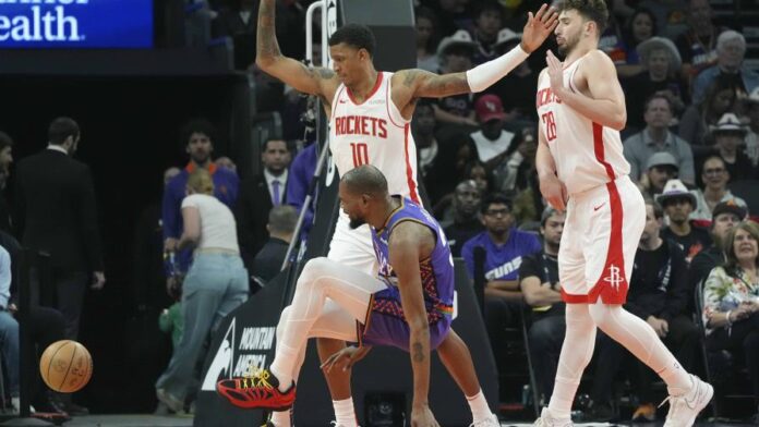 La estrella Kevin Durant sale del campo tras lesionarse la pierna izquierda con los Suns La estrella Kevin Durant sale del campo tras lesionarse la pierna izquierda con los Suns
